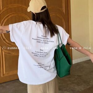 White T with print on back